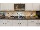 Kitchen featuring stainless microwave, ceramic cooktop, and granite countertops at 10751 Tavistock Dr, Tampa, FL 33626