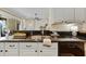 Kitchen close up showcasing stainless sink, new faucet, and under cabinet lighting at 10751 Tavistock Dr, Tampa, FL 33626