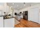 Spacious kitchen with stainless appliances, white cabinets, and hardwood flooring at 10751 Tavistock Dr, Tampa, FL 33626