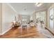 Bright living room with hardwood floors, neutral paint, and large windows for plenty of natural light at 10751 Tavistock Dr, Tampa, FL 33626