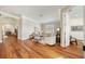 Open-concept living space featuring hardwood floors, neutral colors, and seamless flow to other rooms at 10751 Tavistock Dr, Tampa, FL 33626