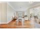 Open-concept living room with hardwood floors, large windows, and elegant furniture at 10751 Tavistock Dr, Tampa, FL 33626