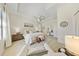 Spacious bedroom features tray ceiling, ceiling fan, ensuite bathroom, and a sitting area with a view at 10751 Tavistock Dr, Tampa, FL 33626