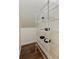 View of a pantry with white metal shelving, ideal for storing food and supplies at 10751 Tavistock Dr, Tampa, FL 33626