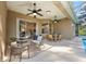 View of the outdoor patio featuring a lounge area, dining set, ceiling fans, and access to pool at 10751 Tavistock Dr, Tampa, FL 33626