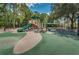 Outdoor playground with slides, climbing structures, and a soft, safe play surface, perfect for Gathering fun at 10751 Tavistock Dr, Tampa, FL 33626