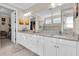Bright bathroom featuring a double vanity with granite counters and a tiled walk-in shower at 11039 Calluna Dr, Odessa, FL 33556