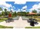 Community bocce ball courts with picnic tables and orange umbrellas at 11039 Calluna Dr, Odessa, FL 33556