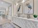 Elegant hallway featuring stylish furniture, decor, and tile flooring at 11039 Calluna Dr, Odessa, FL 33556