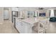 Spacious kitchen island with stainless steel dishwasher and sink, breakfast bar and modern finishes at 11039 Calluna Dr, Odessa, FL 33556