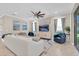 Bright and airy living room featuring modern furniture, artwork, and ample natural light at 11039 Calluna Dr, Odessa, FL 33556