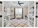 Home office with french doors, neutral decor, and a comfortable seating area at 11039 Calluna Dr, Odessa, FL 33556