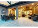 Inviting covered patio with dining and seating areas, perfect for outdoor entertaining at 11039 Calluna Dr, Odessa, FL 33556