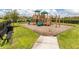 Neighborhood playground with slides, climbing equipment, and mulch surface at 11039 Calluna Dr, Odessa, FL 33556