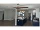 Bright kitchen boasts a large island, stainless steel refrigerator, and stylish pendant lighting at 11110 1St E St, Treasure Island, FL 33706