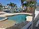 Backyard pool with a spa and lush landscaping at 11110 1St E St, Treasure Island, FL 33706