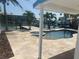 Outdoor pool with a spa, dock, and canal view at 11110 1St E St, Treasure Island, FL 33706