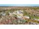 Aerial view outlining a home's location amid lush greenery and surrounding residential neighborhood at 11620 Eastern Star Ct, New Port Richey, FL 34654