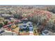 Aerial view highlighting a well-maintained property with a scenic landscape and lush tree coverage at 11620 Eastern Star Ct, New Port Richey, FL 34654
