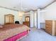 Bedroom with bed, ceiling fan, dresser, furniture, and a built-in desk at 11620 Eastern Star Ct, New Port Richey, FL 34654