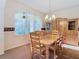 Cozy dining room featuring a bright window and a wooden dining set at 11620 Eastern Star Ct, New Port Richey, FL 34654