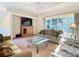 Comfortable living room with a large window providing natural light at 11620 Eastern Star Ct, New Port Richey, FL 34654