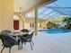 Inviting pool area with a covered patio perfect for outdoor dining and relaxation at 11620 Eastern Star Ct, New Port Richey, FL 34654