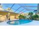 Beautiful screened pool with tropical landscaping, offering a private outdoor retreat at 11620 Eastern Star Ct, New Port Richey, FL 34654
