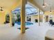 View of a screened-in pool surrounded by tropical landscaping, offering a private outdoor retreat at 11620 Eastern Star Ct, New Port Richey, FL 34654
