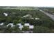 Aerial view of community, surrounded by lush trees, buildings and parking at 11705 Raintree Village Blvd # C, Temple Terrace, FL 33617