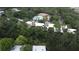 An aerial view showcases lush green landscaping and a community pool at 11705 Raintree Village Blvd # C, Temple Terrace, FL 33617