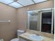 Bathroom view featuring a vanity with a marble countertop and a toilet at 11705 Raintree Village Blvd # C, Temple Terrace, FL 33617