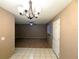 An open living space featuring a ceiling fan and dining room access at 11705 Raintree Village Blvd # C, Temple Terrace, FL 33617
