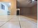Open concept living room and kitchen area features tile and laminate flooring at 11705 Raintree Village Blvd # C, Temple Terrace, FL 33617