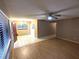View of open living space with combination tile/laminate flooring at 11705 Raintree Village Blvd # C, Temple Terrace, FL 33617