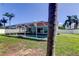 Amazing screened-in pool with a large backyard, perfect for entertaining and relaxing outdoors at 12004 Plantain Ct, Tampa, FL 33635