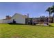 Spacious yard, featuring a screened-in lanai, with a pool offering a private and serene setting at 12004 Plantain Ct, Tampa, FL 33635