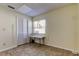 Well lit bedroom features a neutral color scheme, closet and a window at 12004 Plantain Ct, Tampa, FL 33635