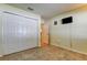 Bedroom featuring a closet, neutral color scheme and a mounted television at 12004 Plantain Ct, Tampa, FL 33635