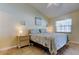 Bright bedroom featuring tiled floors, a ceiling fan, and a cozy ambiance at 12004 Plantain Ct, Tampa, FL 33635