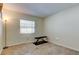 Bedroom featuring a neutral color scheme, bench, and a window at 12004 Plantain Ct, Tampa, FL 33635