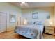 Comfortable bedroom with tiled floors, a ceiling fan, and soft, natural light at 12004 Plantain Ct, Tampa, FL 33635