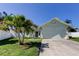 Charming single-story home with a well-maintained lawn and a two car garage at 12004 Plantain Ct, Tampa, FL 33635