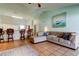Spacious living room with a cozy sectional, breakfast bar and kitchen access at 12004 Plantain Ct, Tampa, FL 33635