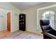 Office space with arched window, a ceiling fan, and a convenient door to the exterior at 12004 Plantain Ct, Tampa, FL 33635
