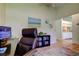 Bright office space with an open layout to kitchen, enhancing connectivity and functionality at 12004 Plantain Ct, Tampa, FL 33635