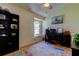 Comfortable office featuring a vaulted ceiling and arched window for natural light at 12004 Plantain Ct, Tampa, FL 33635