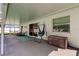 Covered patio with seating, a hanging hammock, and access to the backyard at 12004 Plantain Ct, Tampa, FL 33635