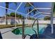 Enjoy this screened pool area with a fenced yard, making the perfect outdoor oasis to unwind at 12004 Plantain Ct, Tampa, FL 33635