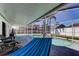 Screened in Pool with a patio, chairs and a hammock at 12004 Plantain Ct, Tampa, FL 33635